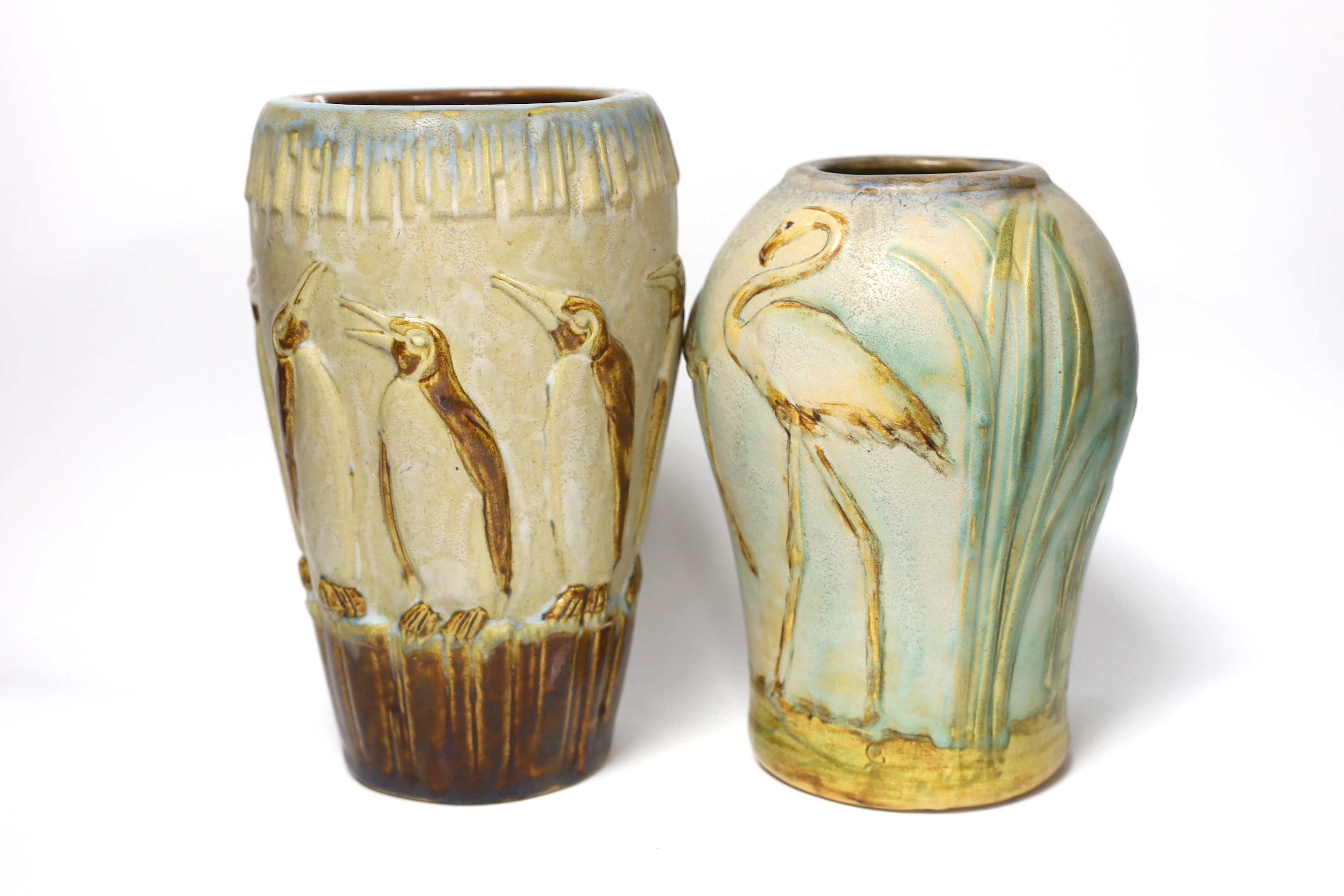 Two Denby ware pottery vases decorated in relief with penguins and flamingos, largest 26cm high